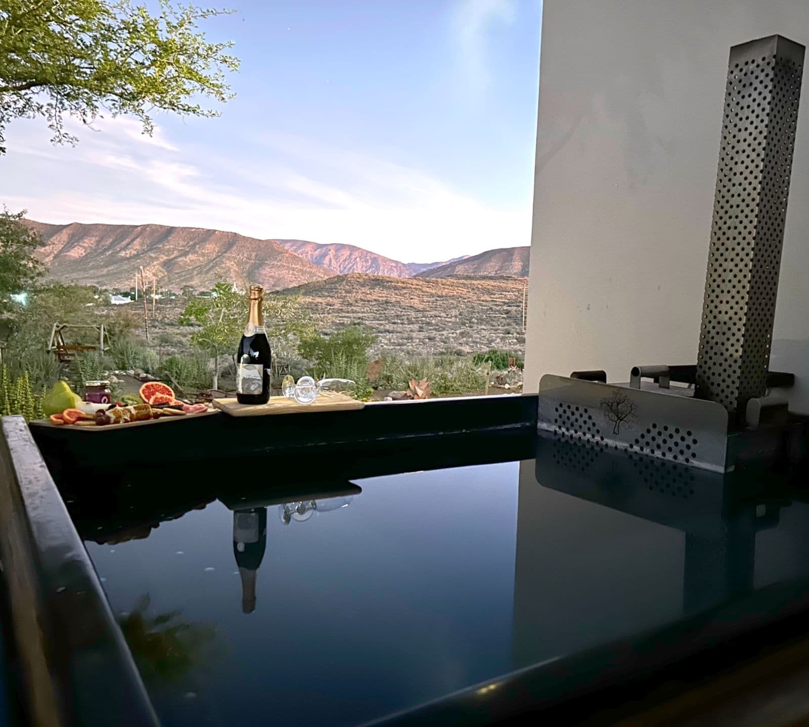 Karoo View Cottages: Dusk hot tub with champagne and charcuterie, glowing Karoo mountains